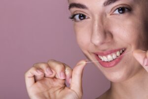 young girl flossing