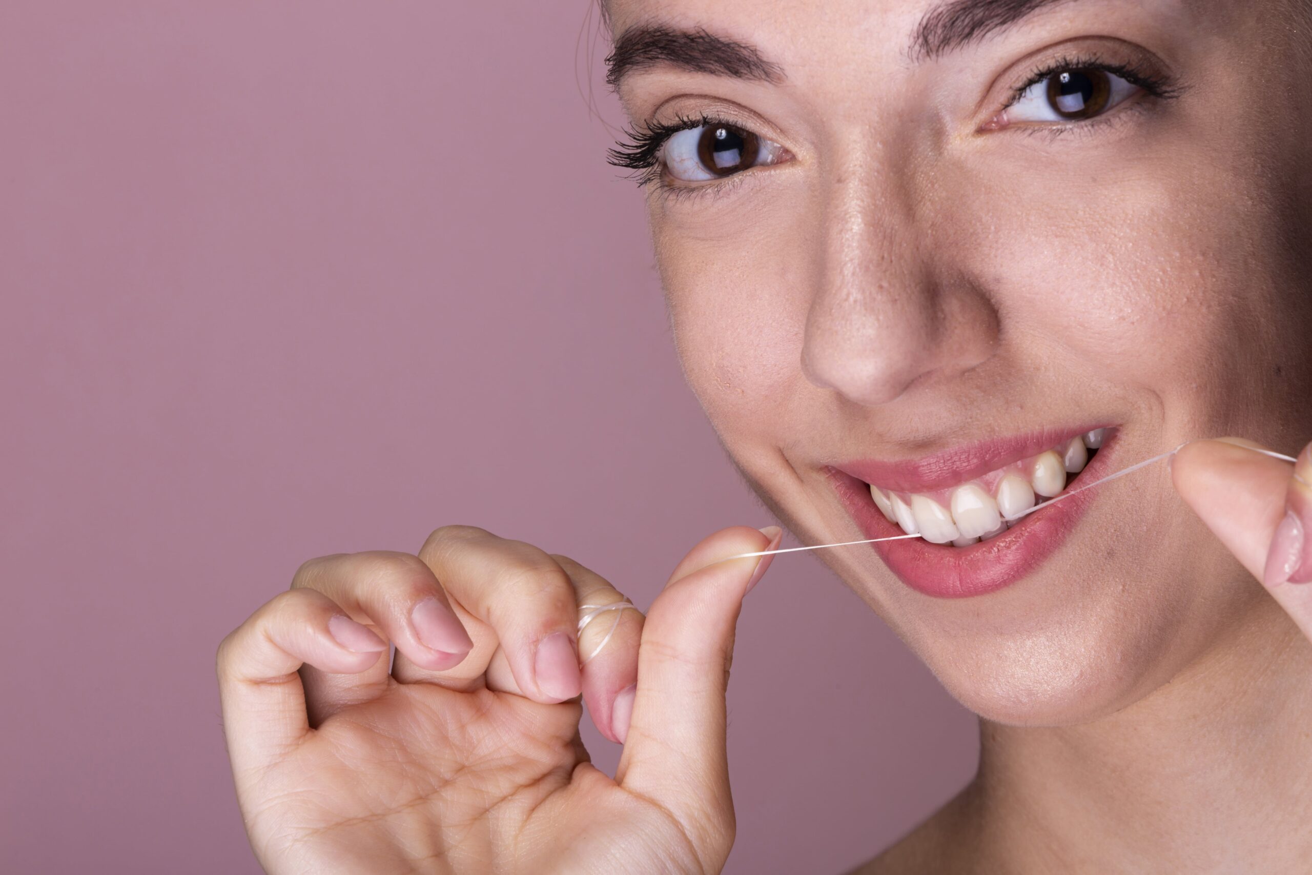 young girl flossing